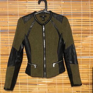 Tight dark green women’s motorcycle jacket